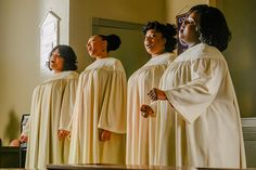 a group of women standing next to each other