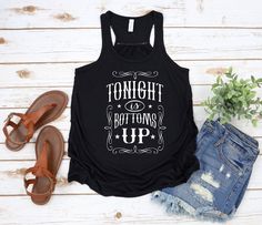 "Head to your favorite country concert in style! Black racerback tank with white HTV lettering reads \"Tonight is Bottoms Up\" I wear this often and get compliments every time!" Country Girl Shirts, Racerback Tank, Festival Outfits, Country Girls, Tank Top Fashion, Tank Tops Women, Womens Clothing Tops, What To Wear