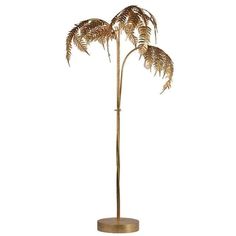 a tall brass palm tree with three leaves on it's base, in front of a white background