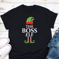 The Boss Elf Merry Christmas Shirt, Christmas Elf Shirt, I'm The Boss Elf Christmas Shirt, Ugly Christmas Shirt, Christmas Gift For Boss Ordering Process for our valued customers ~ Please follow all steps to place an order. ~ Please select the hoodie type and size. ~ Please select color of the hoodie from drop down options. ~ If you want to purchase more than 1 , add current item to your cart and then you can click back, add more items for each product. ~ Once all your desired items , you can co Sarcastic Christmas Shirt, Soccer Fan Gifts, Sarcastic Christmas, Elves Gift, Elf Shirt, Ugly Christmas Shirts, Christmas Party Shirts, King Shirt, Queen Shirts