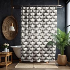 a bathroom with a bathtub, rug and potted plant