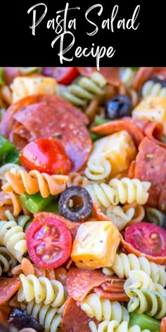 a pasta salad with tomatoes, olives, broccoli and other toppings