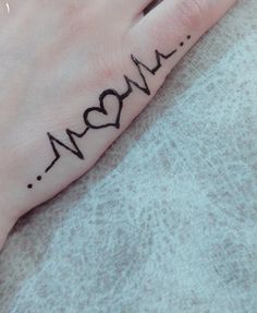 a woman's hand with the word mom written on it