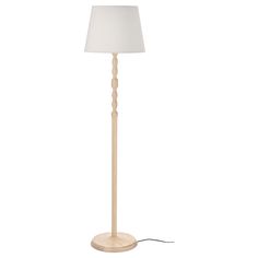 a wooden floor lamp with a white shade on it's base and a light bulb plugged in