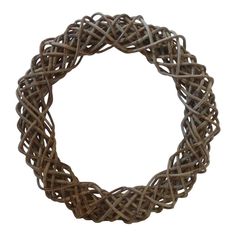 a round shaped wreath made out of wicker