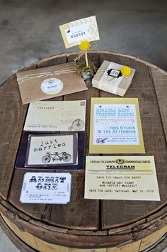 the table is set up with some cards and envelopes on it, along with other stationery items