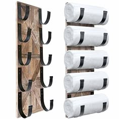 a wooden rack with four rolls of toilet paper hanging from it's sides, and three roll holders on each side