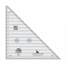 a triangle ruler with white dots on the bottom and one side that has an image of a