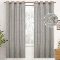 the curtains in this living room are made out of linen and have a gray color scheme