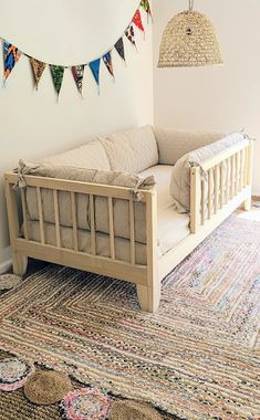 a white couch sitting on top of a rug in a living room