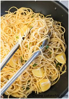 pasta with parmesan cheese and herbs in a skillet