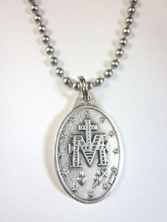 "English Miraculous Medal Pendant Necklace Medal design given by the Blessed Virgin to St. Catherine Labouré in 1830. Patronage: Special graces 1\" Die-cast silver oxidized medal signed Italy 24\" Stainless Steel Ball Bead chain can be cut shorter to size made in U.S.A. Gift Boxed Prayer card included image detail shown" Antique Silver Medallion With Miraculous Medal, Silver Miraculous Medal Jewelry As Gift, Silver Miraculous Medal Necklace For Commemoration, Commemorative Silver Jewelry With Miraculous Medal, St Albert The Great, Medal Design, St Bridget, St Joan, St Catherine