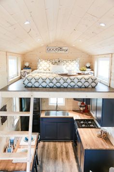 the interior of a tiny house with wood flooring