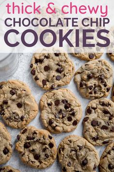 chocolate chip cookies on a baking sheet with glass of milk