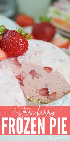 a strawberry frozen pie on a plate with strawberries