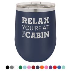 the words relax you're at the cabin on a navy colored tumbler cup