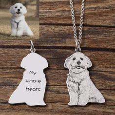 two dogs are shown with their names engraved on the pendants, one is white and the other is black