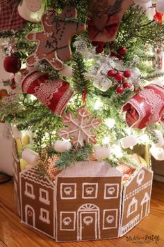 a small christmas tree with gingerbread houses on it