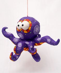 an octopus ornament hanging from a string