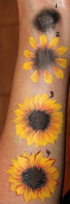 sunflowers painted on the side of a woman's arm