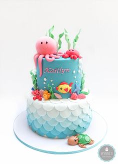 a blue cake with an octopus and sea animals on it