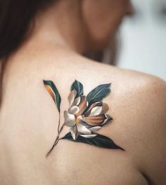 a woman with a flower tattoo on her shoulder