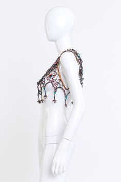 Beautiful heavily embellished rhinestone crystal beaded crop vest top which can be worn over a garment or daringly by itself. We believe this piece to be custom made. Statement weighted crystal overlay top Gunmetal, amber, amethyst, aquamarine, rose quartz, ruby, sapphire, tourmaline, topaz Prong set multi-sized & shape faceted crystal rhinestone construction connected with metal net braid chain & ladder bar links Jewel neckline Open front, push box clasp closure neck - can be clasped either fro Festival Embellished Sleeveless Crop Top, Embellished Sleeveless Crop Top For Festival, Sleeveless Embellished Crop Top For Festivals, Beaded Fitted Sleeveless Crop Top, Multicolor Beaded Tops For Festival, Sleeveless Beaded Fitted Crop Top, Crystal Overlay, Cropped Vest Top, Ladder Bar