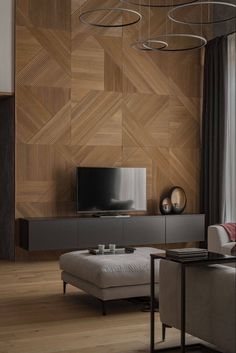 a modern living room with wood paneling on the wall