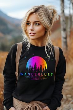 Introducing our Wanderlust Camping Sweatshirt, the perfect companion for your outdoor adventures! This crewneck features a vibrant and colorful gradient nature scene that will transport you to the great outdoors every time you wear it. The word "Wanderlust" emblazoned across the front serves as a reminder of your passion for exploration and the call of the wild. Hiking Outfit