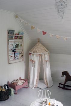 a small child's room with a rocking horse