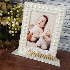 a photo frame with the word radniks on it next to some flowers