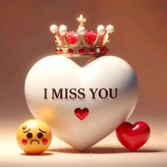 a heart with a crown and two emoticions next to it that says i miss you