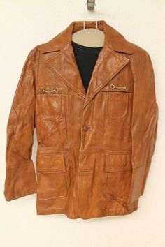 MENS CAPRICORN VINTAGE YAM ORANGE LEATHER CAR COAT/JACKET SZ 40 ITEM FEATURES Brand: CAPRICORN VINTAGE YAM (ORANGE) LEATHER CAR COAT JACKET  Material           Outside: Leather             Liner:   NYLON          Condition         Outside: Very Good. Minor nicks and scuffs. LOOSE BUTTON, MISSING BUTTON.  (see pictures)         Liner: TARES AND FRAY THROUGHOUT.  (see pictures) Size: 40 (SEE MEASUREMENTS) (Sizes vary between brands and eras, so please use the measurements below for a better gauge Formal Brown Outerwear With Leather Lining, Vintage Long Leather Jacket For Fall, Brown Single Breasted Long Sport Coat, Brown Leather Long Coat Jacket, Retro Brown Leather Outerwear, Brown Long Sleeve Outerwear With Leather Lining, Vintage Distressed Brown Outerwear With Pockets, Retro Leather Outerwear For Formal Occasions, Vintage Outerwear With Leather Lining For Work