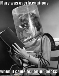 a woman sitting in a chair reading a book with her head covered by a plastic covering