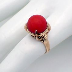 Vintage 18 K (.750) yellow gold ring, having tall open-work setting, decorated with ball form Coral stone. This majestic ring is a size 6 1/2, weighing 7.5 grams. The Coral is 12.5 mm in diameter.  EA2808 14k Gold Dome Ring With Cabochon, Formal Red Domed Rings, Formal Red Dome Ring, Antique Filigree Ring With Cabochon, Coral Ring, Coral Stone, Yellow Gold Ring, Girls Best Friend, Yellow Gold Rings