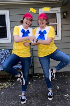 two women dressed in yellow and blue posing for the camera