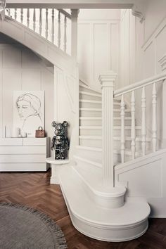 there is a white staircase in the house