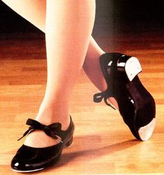 a woman's legs and shoes with the words learn to tap dance