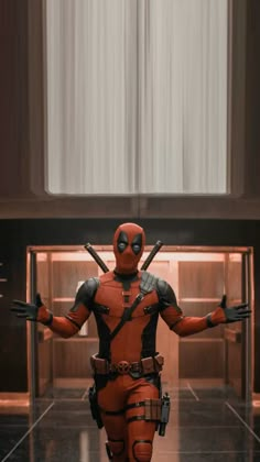 the deadpool character is dressed in red and black