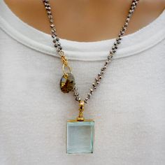 Handcrafted one-of-a-kind necklace, vintage square magnifier pendant on a doubled hand-knotted dainty pyrite chain, a hand-carved labradorite charm dangling from the clasp with a tiny tiny moonstone charm in a vermeil frame. Wear it long or doubled over short. Dress it up or down, chic timeless classic and super stylish! The Necklace measures 30" in length Hand-knotted pyrite chain Vintage pendant Made with love in Los Angeles Complimentary gift wrapping provided All sales final. Elegant Glass Rectangular Pendant Jewelry, Unique Rectangular Glass Jewelry, Glass Locket Pendant, Charm Holder, Glass Locket, Vintage Pendant, Green Agate, Evil Eye Charm, Green Onyx