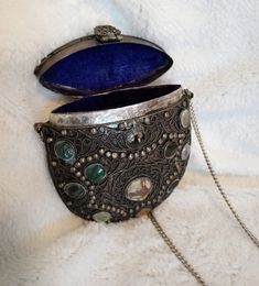 "This beautifully made metal handbag purse is intricately made with metalwork, jewels, stones and lined with a cobalt blue lining.  Reminiscent of Victorian era accessories. The purse is 5\" x 4.5\" x 2\" with a 34\" chain." Vintage Silver Rectangular Clutch, Handmade Silver Clutch For Formal Occasions, Handmade Bohemian Evening Bag, Handmade Victorian Evening Bag, Gold Bohemian Evening Bag, Vintage Silver Clutch As Gift, Silver Coin Purse Clutch For Gifts, Vintage Silver Clutch As A Gift, Silver Clutch Coin Purse For Gift