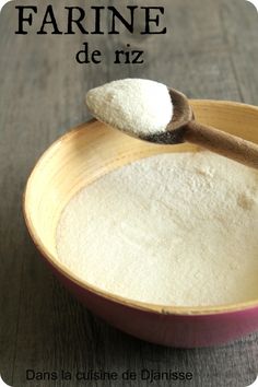 a wooden spoon filled with white powder on top of a pink bowl and the words fahree de riz written above it