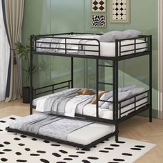 a bunk bed with two sets of mattresses on top of it in a room