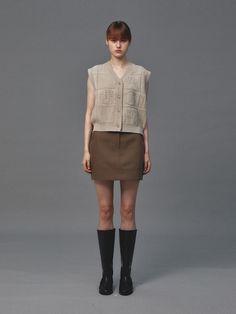 Editor's NotesWool double mini skirt in Ash Brown color designed by LEMME. This basic mini skirt is made from high-density wool-blended fabric and offers an effortless style. You can pair this as a set with Boyfit Double Breasted Jacket.- Hemline combination detail as a highlight  with double stitches across the whole skirt- Front and back pockets to create a casual mood- V neckline could make a feminine moodMeasurements (in.)Size: S / M- Length: 16.5 in / 16.7 in- Waist: 13.5 in /14.5 in- Hip: Beige Skort For Workwear In Fall, Beige Mini Skirt For Winter Workwear, Basic Mini Skirt, Ash Brown Color, Pistachio Color, Ash Brown, Double Breasted Jacket, Knit Vest, Brown Color