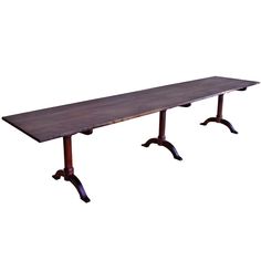 a long wooden table sitting on top of a white background