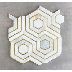 a marble and gold hexagonal wall decoration