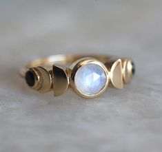 Moonstone Moon Phase Ring with Spinels 14k or 18k Solid Gold | Etsy Moonstone Ring Men, Celestial Moon Shaped Jewelry With Rose Cut Diamonds, Celestial Moon-shaped Jewelry With Rose Cut Diamonds, Celestial Moon-shaped Ring With Rose Cut Diamonds, Celestial Crescent Moonstone Ring For Anniversary, Celestial Moonstone Ring With Moon Phase For Anniversary, Mystical Moonstone Ring With Moon Phase, Celestial Crescent Moonstone Ring, Moonstone Jewelry With Rose Cut Diamonds