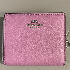 Beautiful Spring Color Wallet By Coach Snap Closure For Main Compartment And Zippered Coin Pocket With Coach Logo Charm 3 Credit Card Slots, 1 Id Window, Full Bill Compartment Measures Approx 4 1/4 “ Elegant Everyday Purple Wallets, Elegant Purple Everyday Wallet, Coach Silver Wallet For Everyday Use, Coach Silver Wallets For Everyday Use, Silver Leather Wallets, Elegant Purple Wallets, Purple Leather Rectangular Wallet, Elegant Purple Bifold Wallet, Pink Coach Leather Wallet