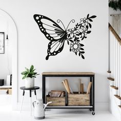 a wall decal with a butterfly and flowers on it's wings is shown