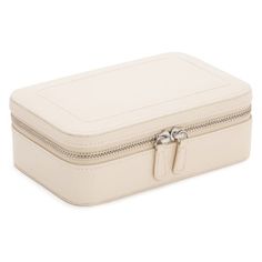 Made of leather in a Ivory, Mink or Rose finish. Leather is a natural product. Variation in color and texture are inherent to each hide; no two pieces are exactly alike. Lining is made of LusterLoc anti-tarnish ultrasuede. Features 1 bracelet compartment with charm well, 3 open compartments and 3 ring rolls. Imported. Never use detergents, polishes, preservers or saddle soap. They can remove natural oils. Do not place in direct sunlight; it will lighten or discolor leather over time. Dust with soft, dry cloth. We do not recommend using harsh household chemicals as they can damage the finish. Museum Display Cases, Antique Silver Jewelry, Silver Jewelry Box, Leather Jewelry Box, Pandora Bracelet Charms, Snap Jewelry, Monogrammed Items, Jewelry Stand, Leather Travel